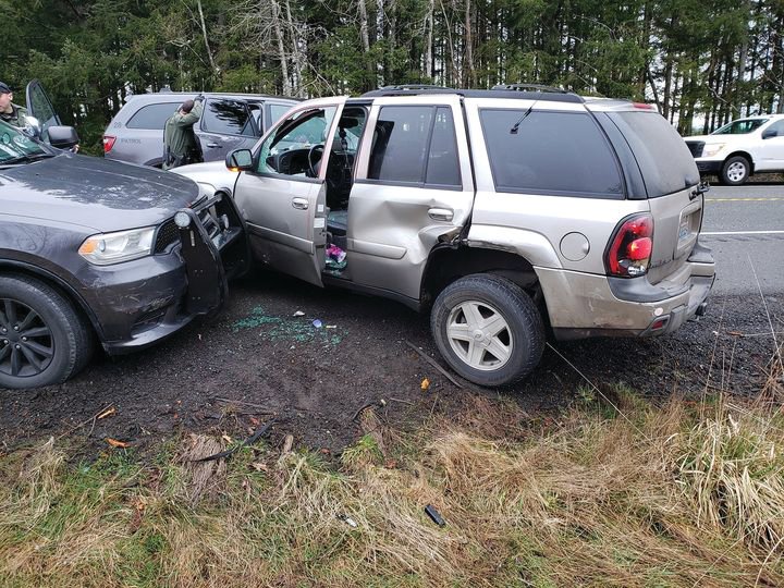 An SUV that was involved in a police chase involving a Port Angeles man sits on the shoulder of Highway 104 after it was stopped by deputies with the Jefferson County Sheriff's Office Thursday morning.